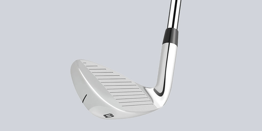 Close-up of precision CNC milled grooves on a golf iron club face for enhanced spin and control on the green