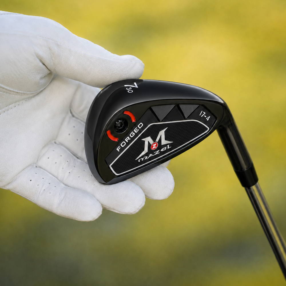 Close-up of MAZEL 7 iron with black hollow-body head and red screw weighting